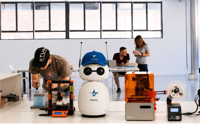 Reachy in a robotics workspace